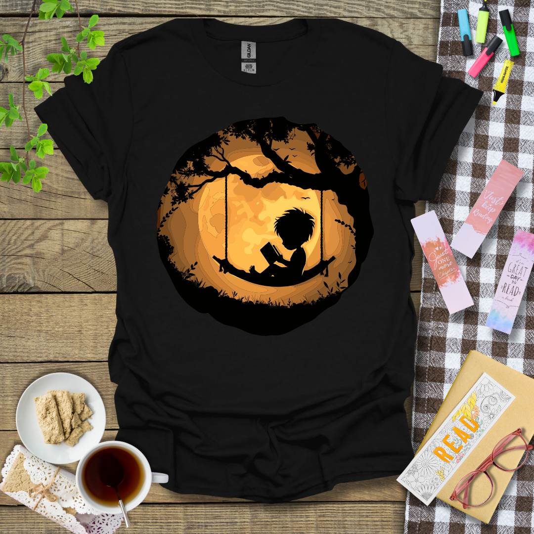 Boy Reading In A Swing Graphic T Shirt