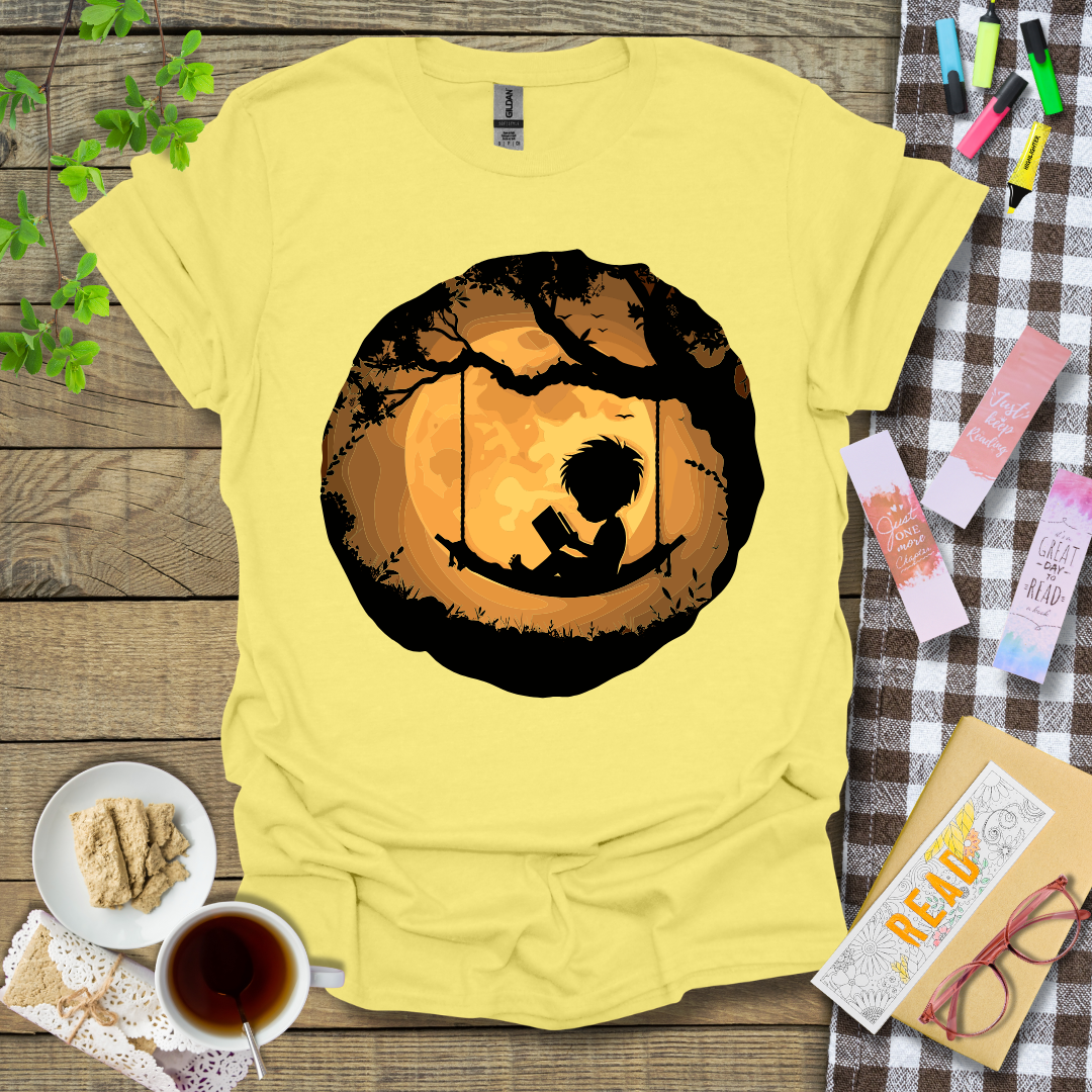 Boy Reading In A Swing Graphic T Shirt