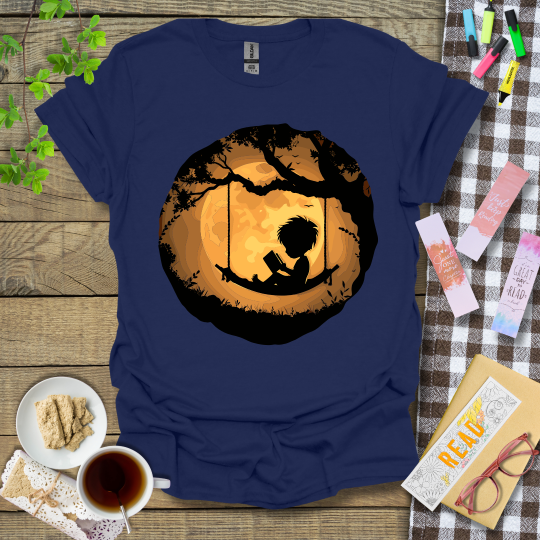 Boy Reading In A Swing Graphic T Shirt